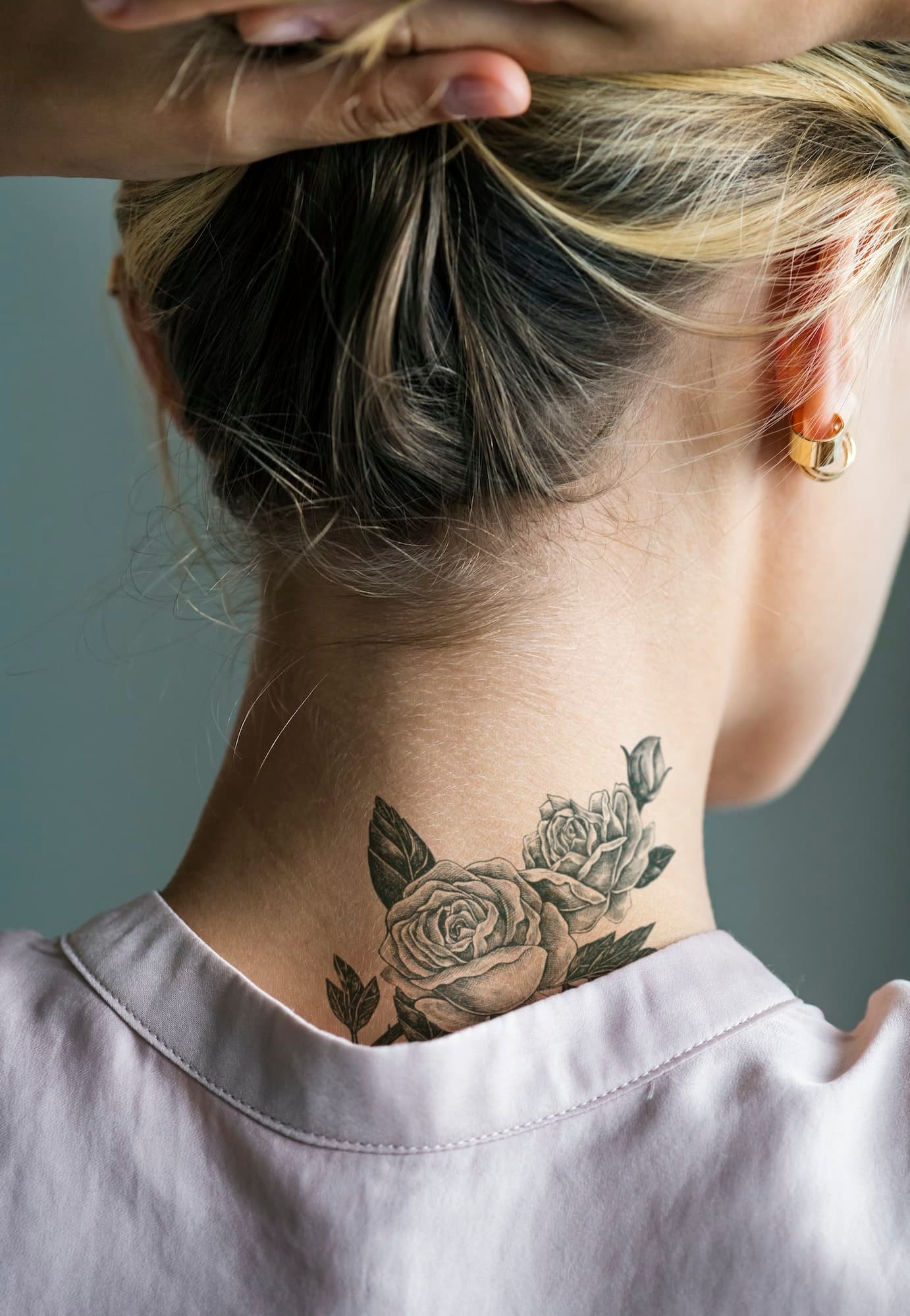 Back neck tattoo of a woman