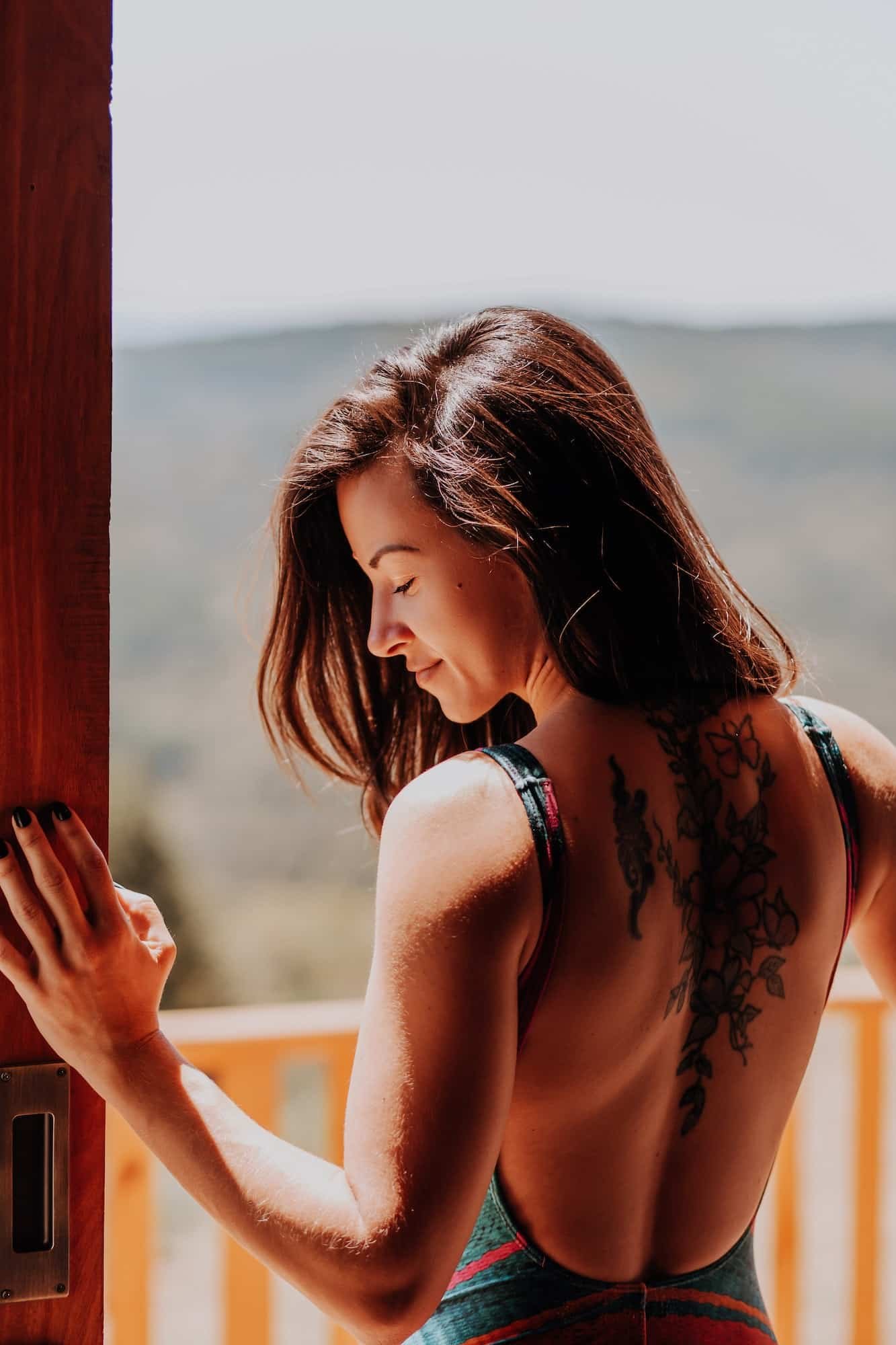 Back view of a tattooed woman